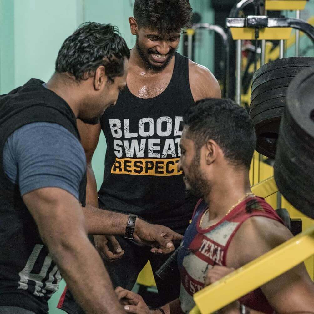 Person lifting weights at the gym, building strength and muscle