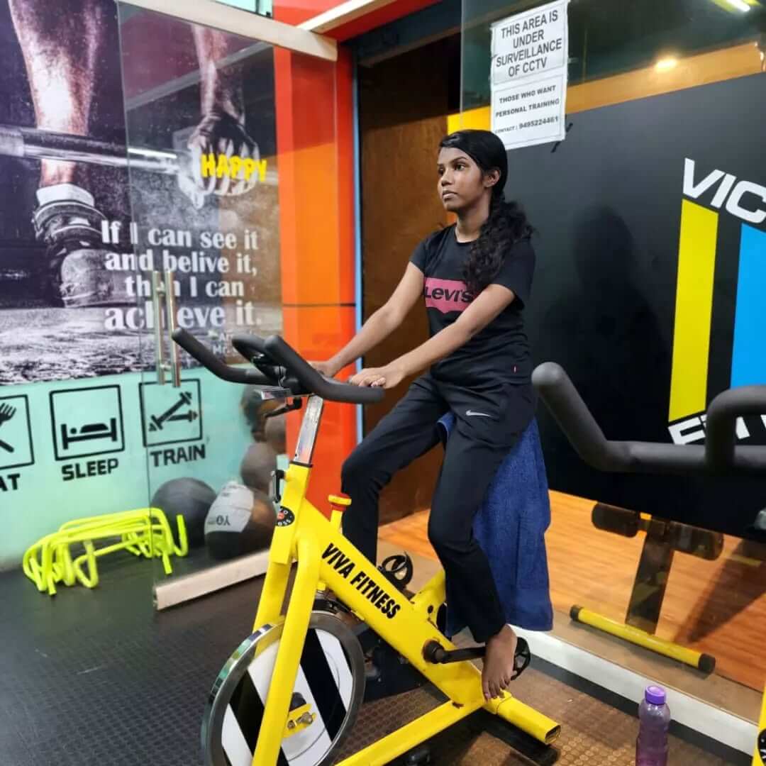 Person lifting weights at the gym, building strength and muscle