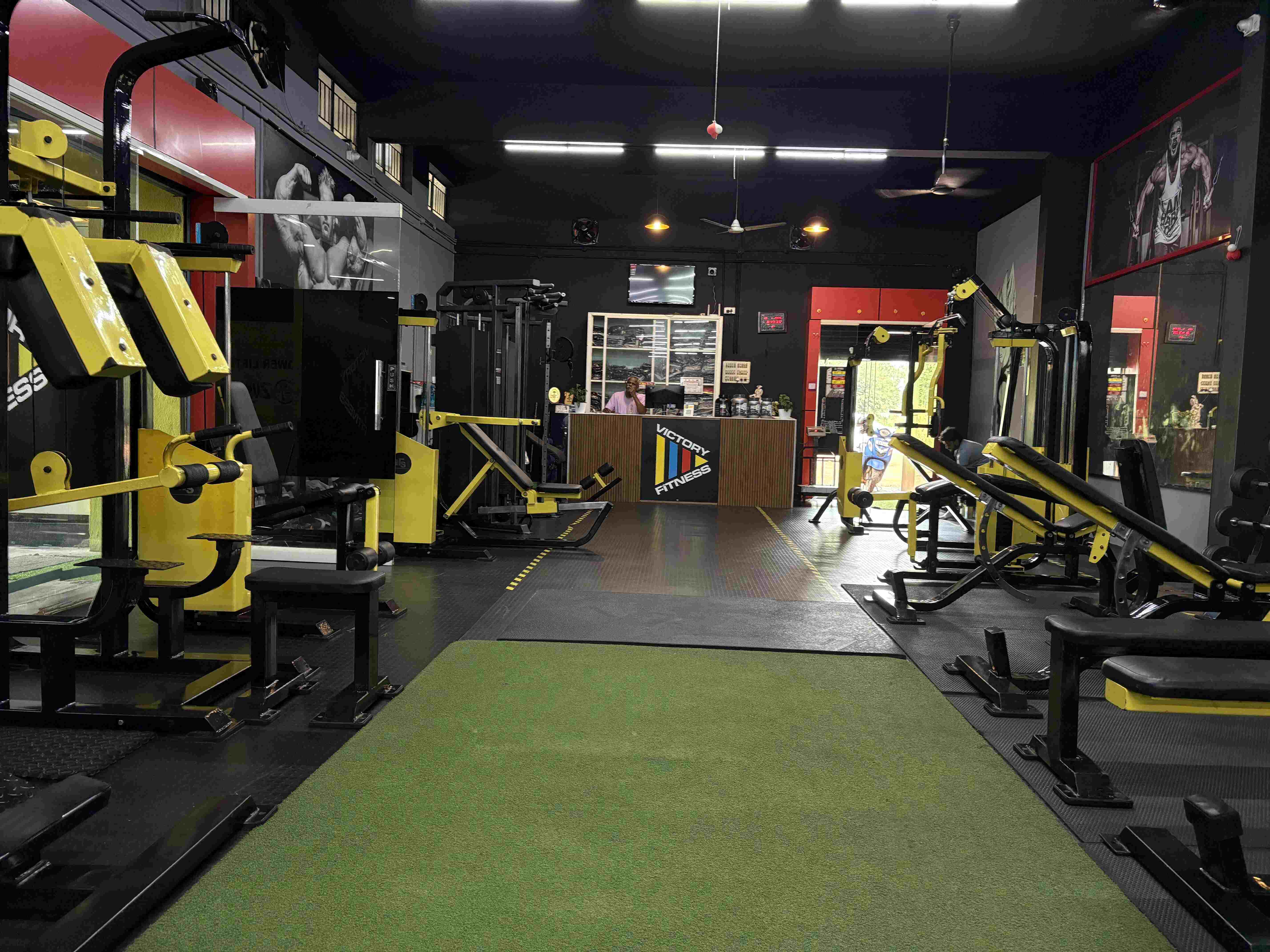Individual performing a deadlift in the gym to enhance core and leg strength