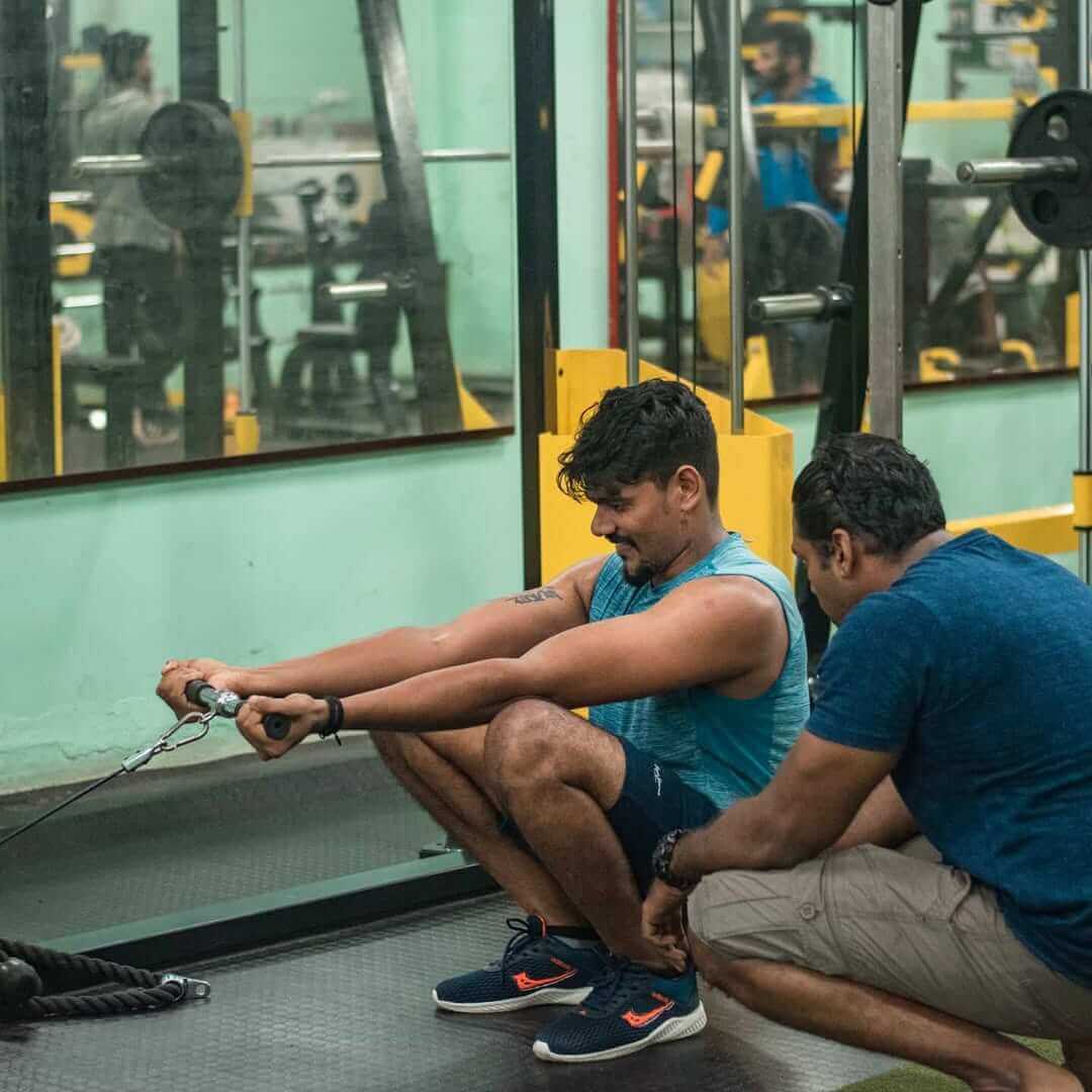 Individual performing a deadlift in the gym to enhance core and leg strength