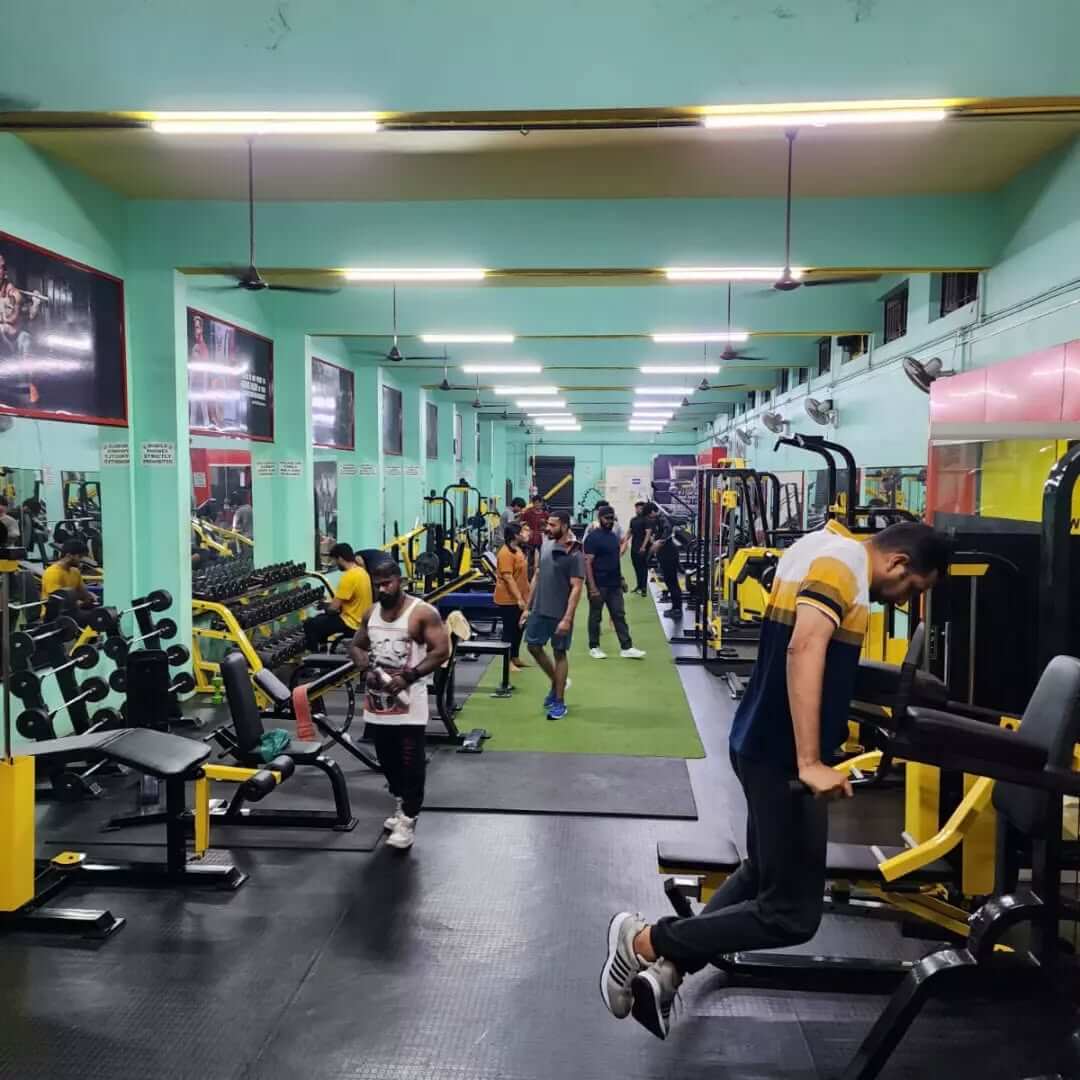 Individual performing a deadlift in the gym to enhance core and leg strength