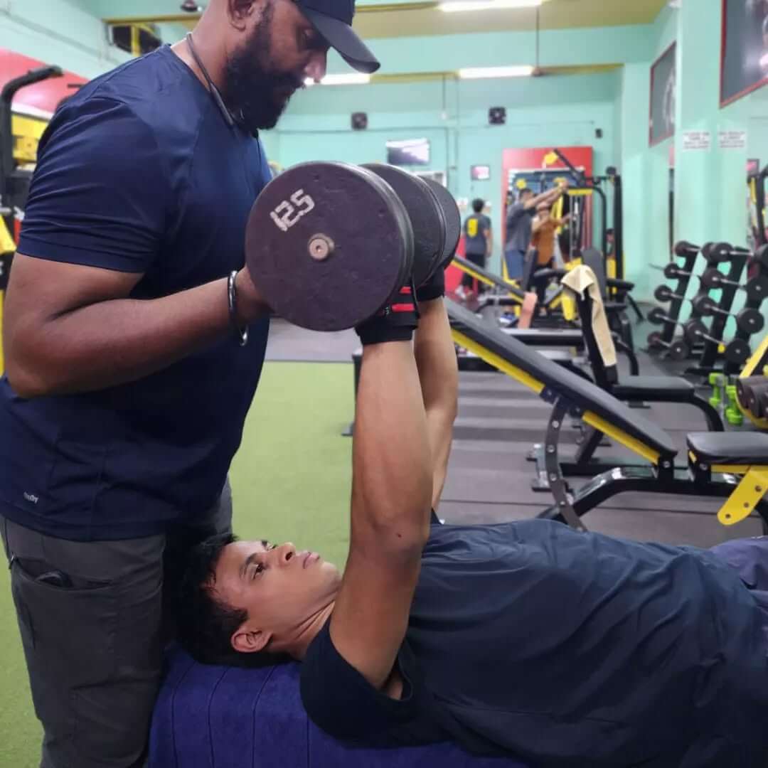 Individual performing a deadlift in the gym to enhance core and leg strength